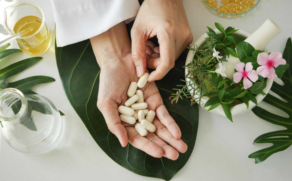 Hand holding pills